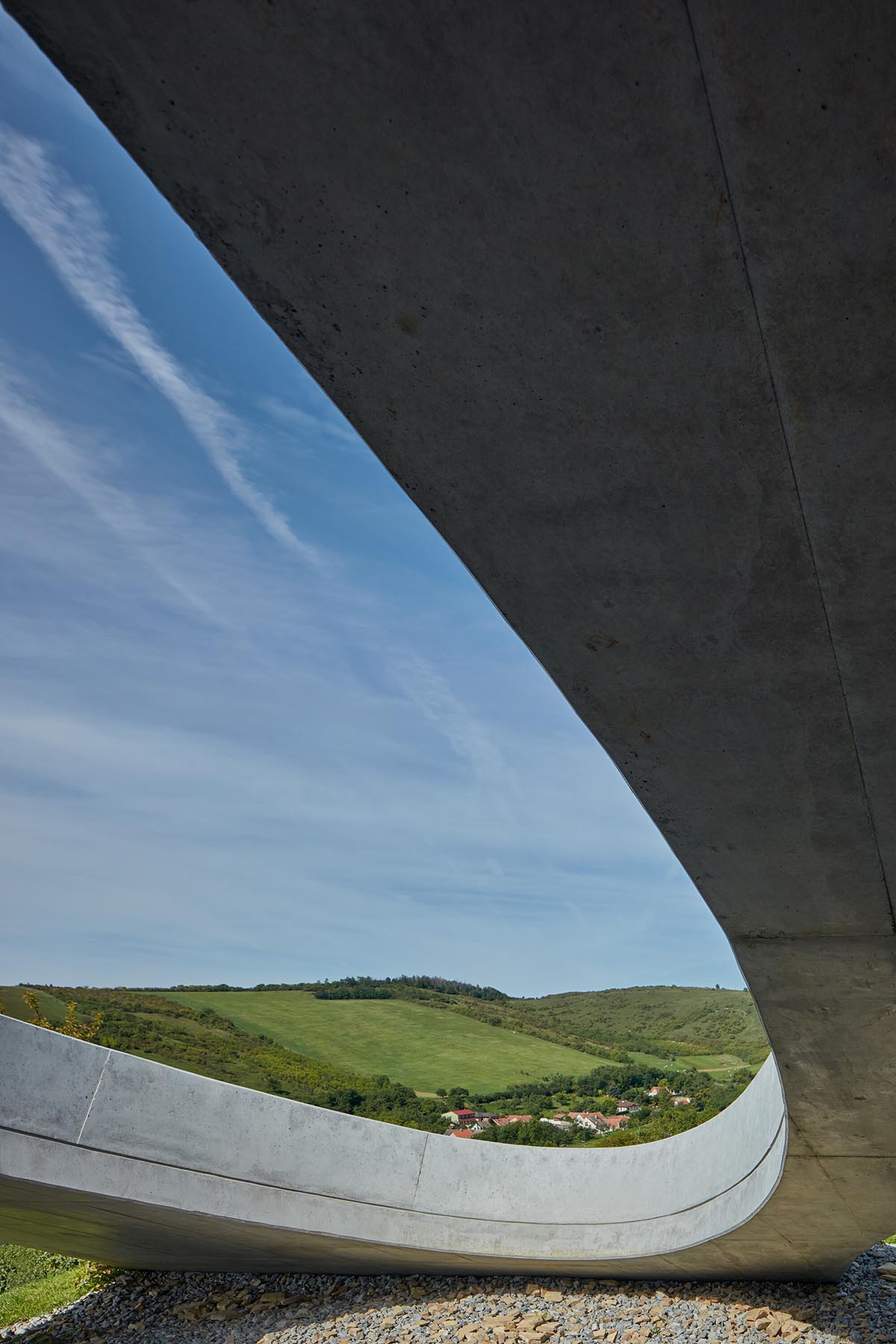 Curved green roof hides winery by Aleš Fiala in a rolling landscape in the Czech Republic