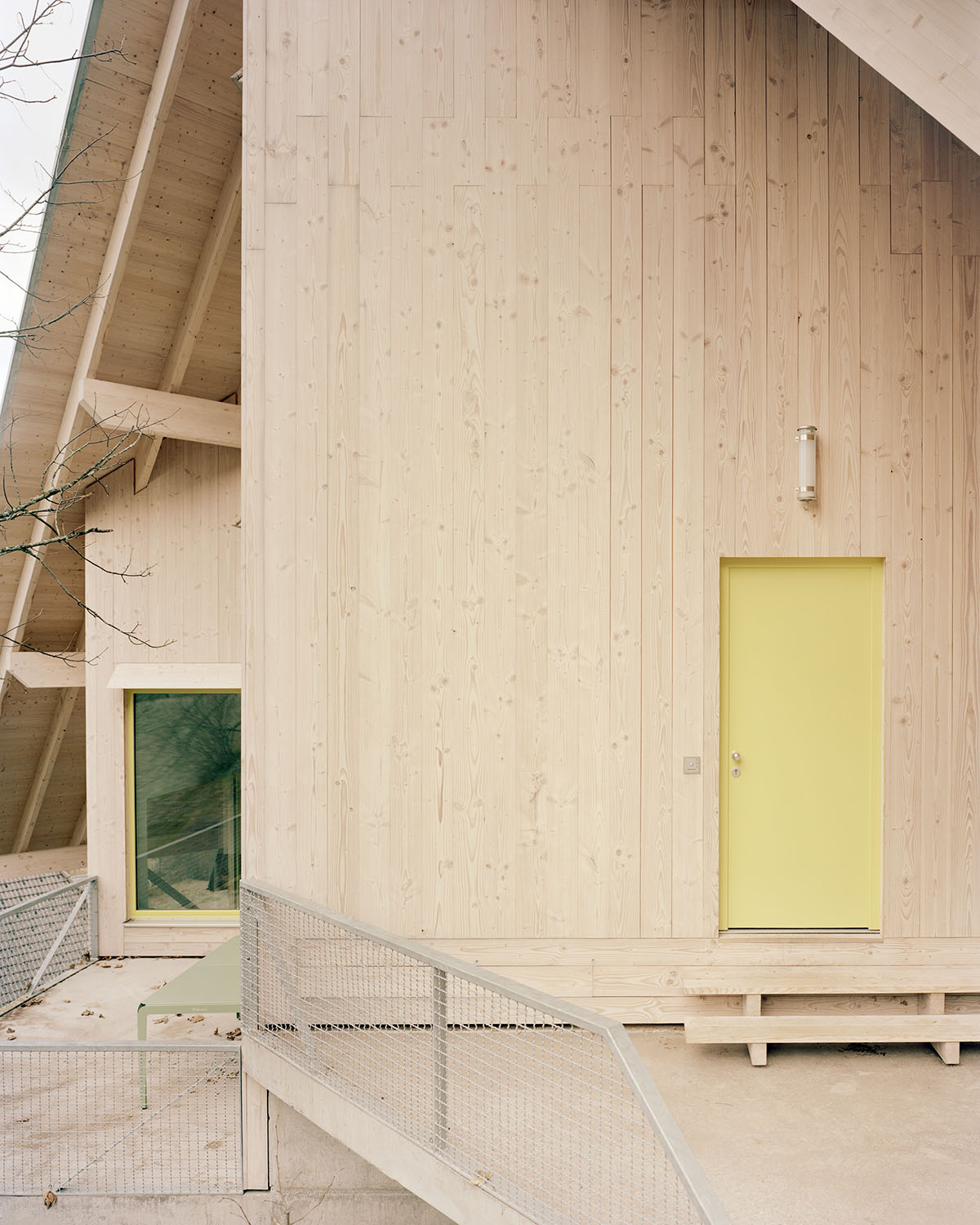 Large timber protrusions define holiday home designed by Amunt on a hillside in Germany