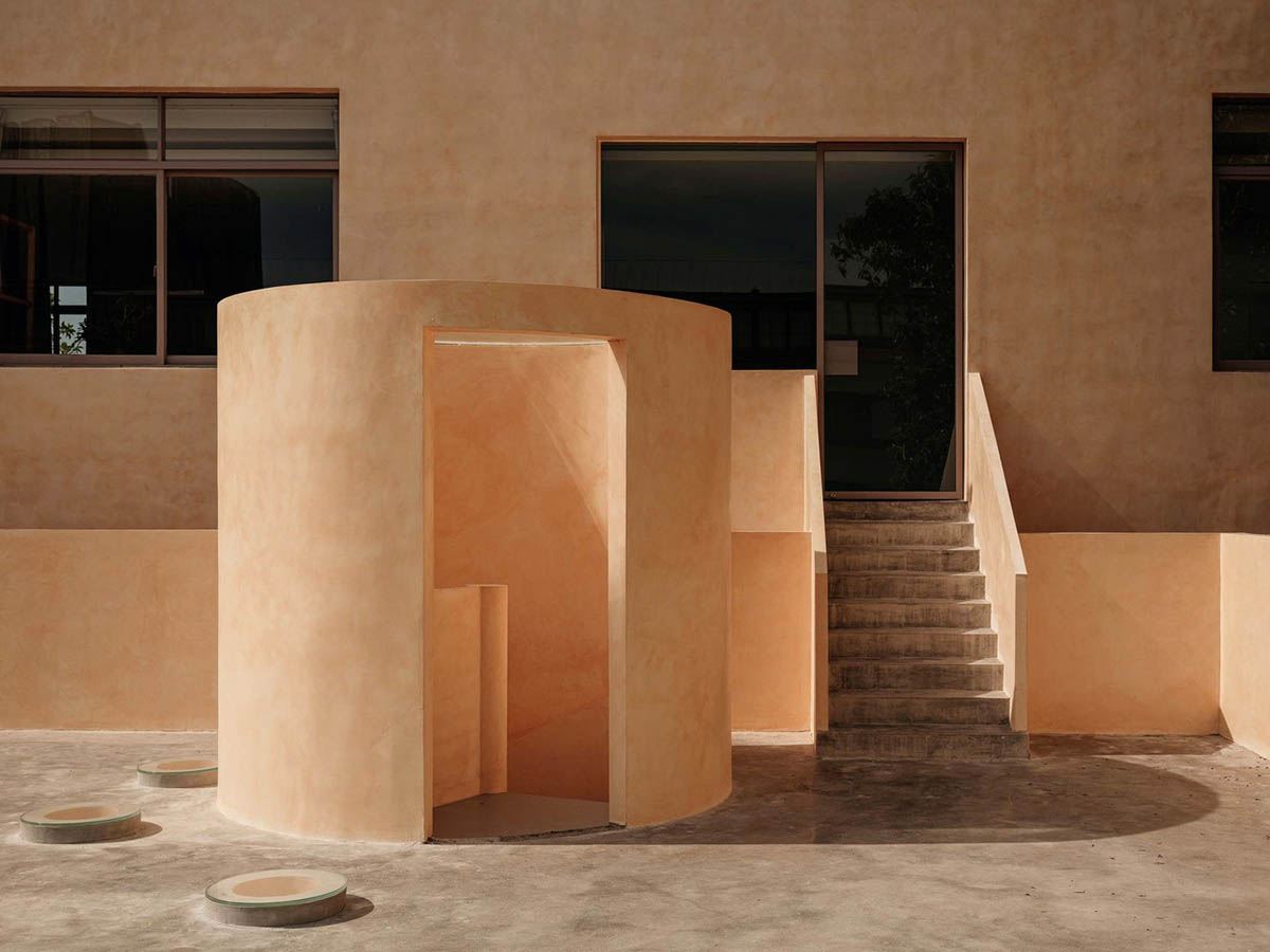 Ladder-Like sandalwood yellow volumes form Buddha artist's exhibition space and studio in China