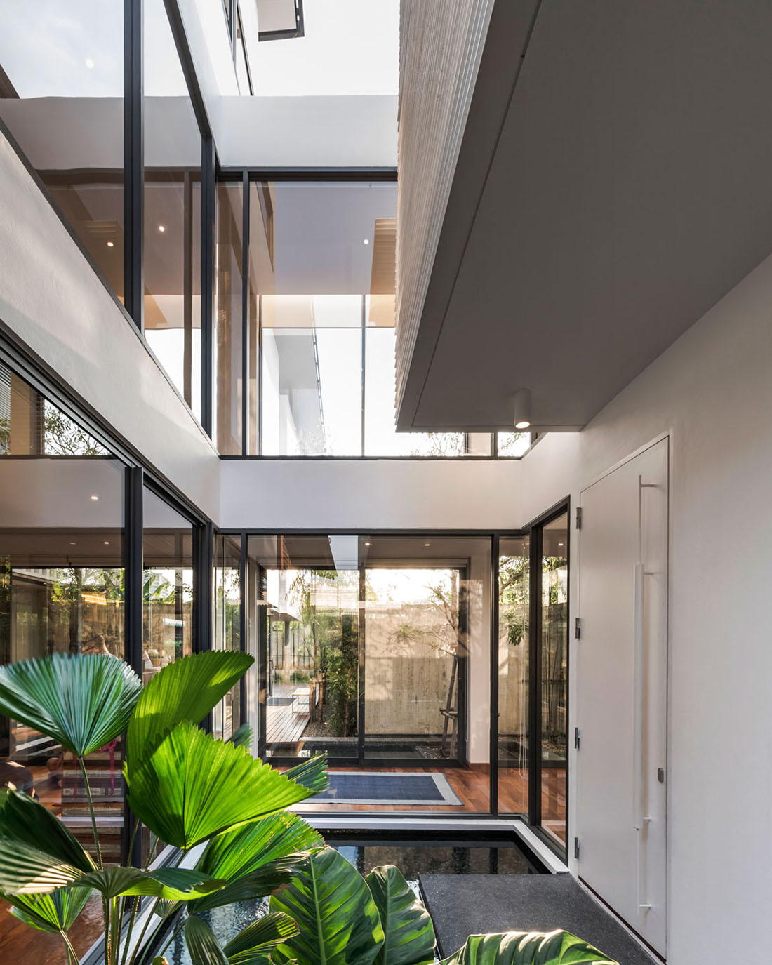 Anonym Studio completes Y House with white louvres in the old neighborhood of Thailand