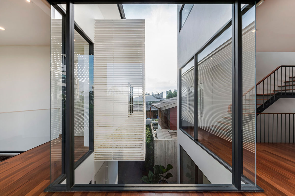 Anonym Studio completes Y House with white louvres in the old neighborhood of Thailand