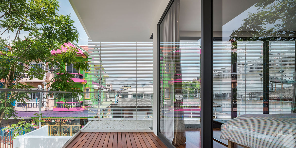 Anonym Studio completes Y House with white louvres in the old neighborhood of Thailand
