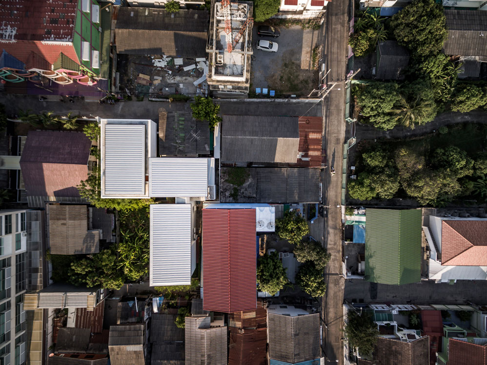 Anonym Studio completes Y House with white louvres in the old neighborhood of Thailand