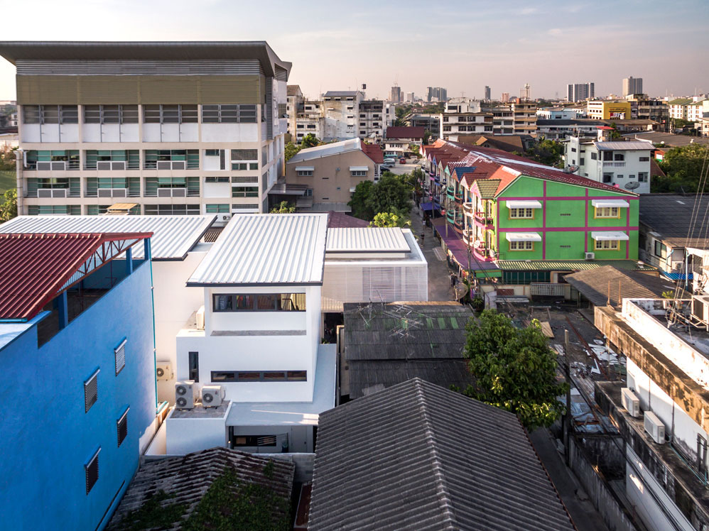 Anonym Studio completes Y House with white louvres in the old neighborhood of Thailand