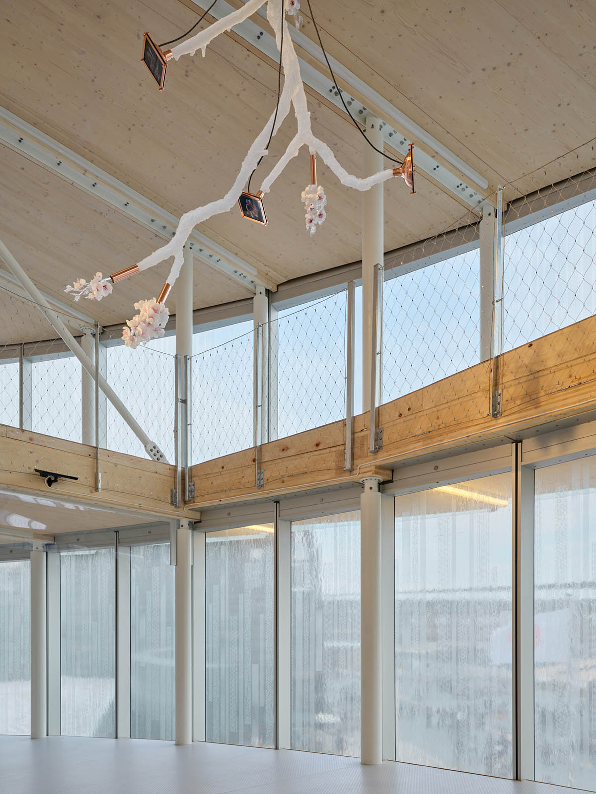 Rotating glass and wooden volumes reflect energy and continuous development at the Czech Pavilion 