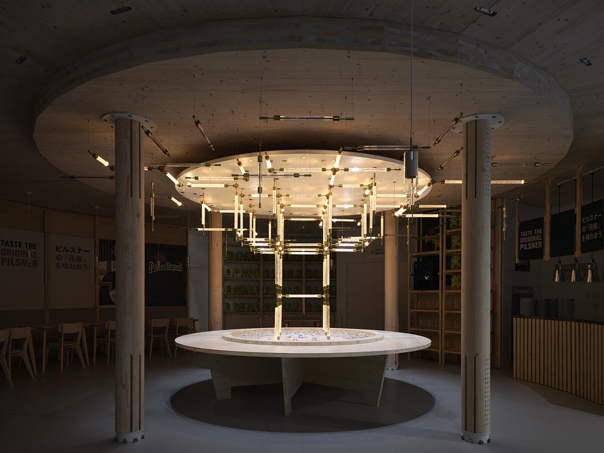 Rotating glass and wooden volumes reflect energy and continuous development at the Czech Pavilion 