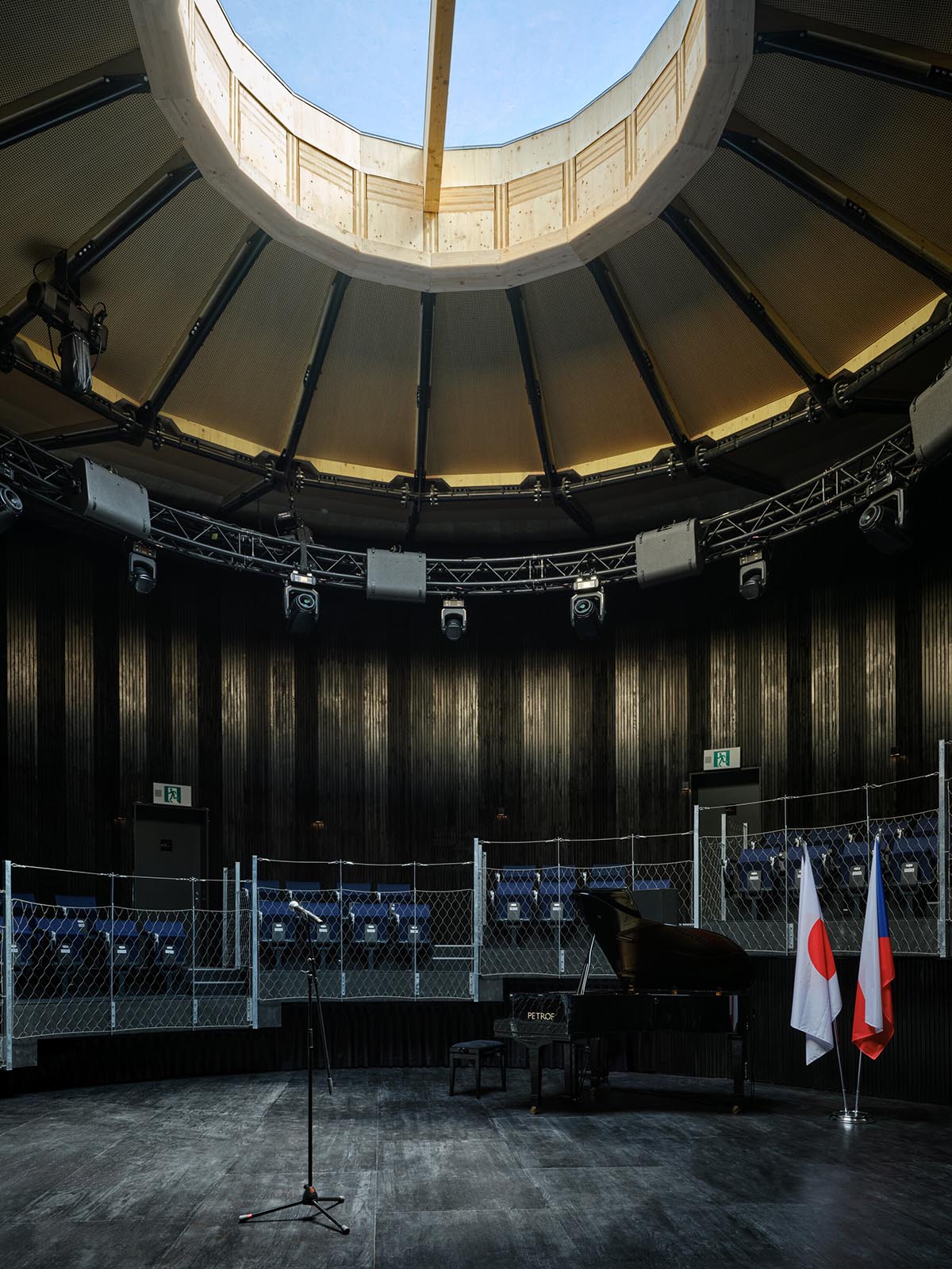 Rotating glass and wooden volumes reflect energy and continuous development at the Czech Pavilion 