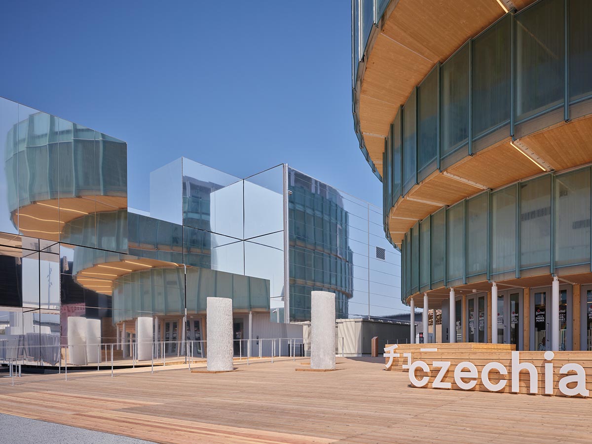 Rotating glass and wooden volumes reflect energy and continuous development at the Czech Pavilion 