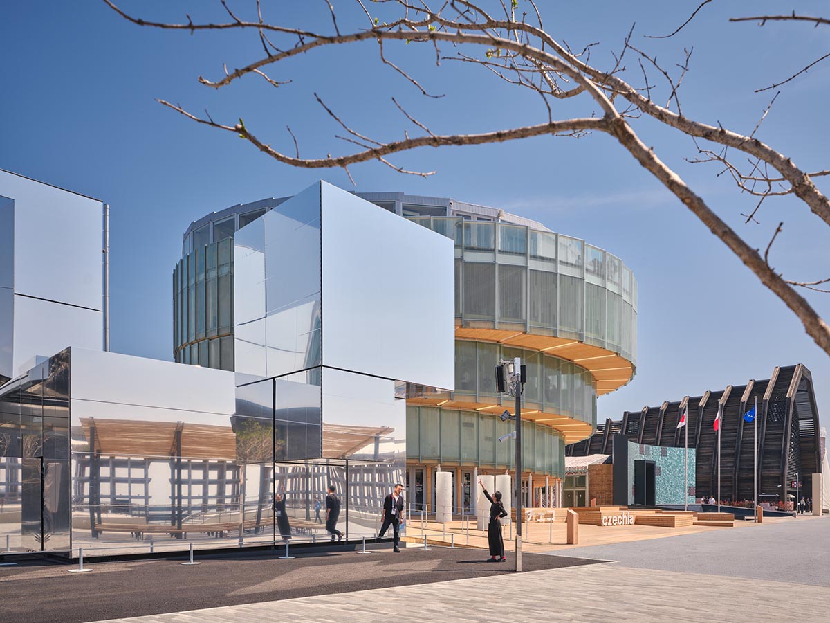 Rotating glass and wooden volumes reflect energy and continuous development at the Czech Pavilion 