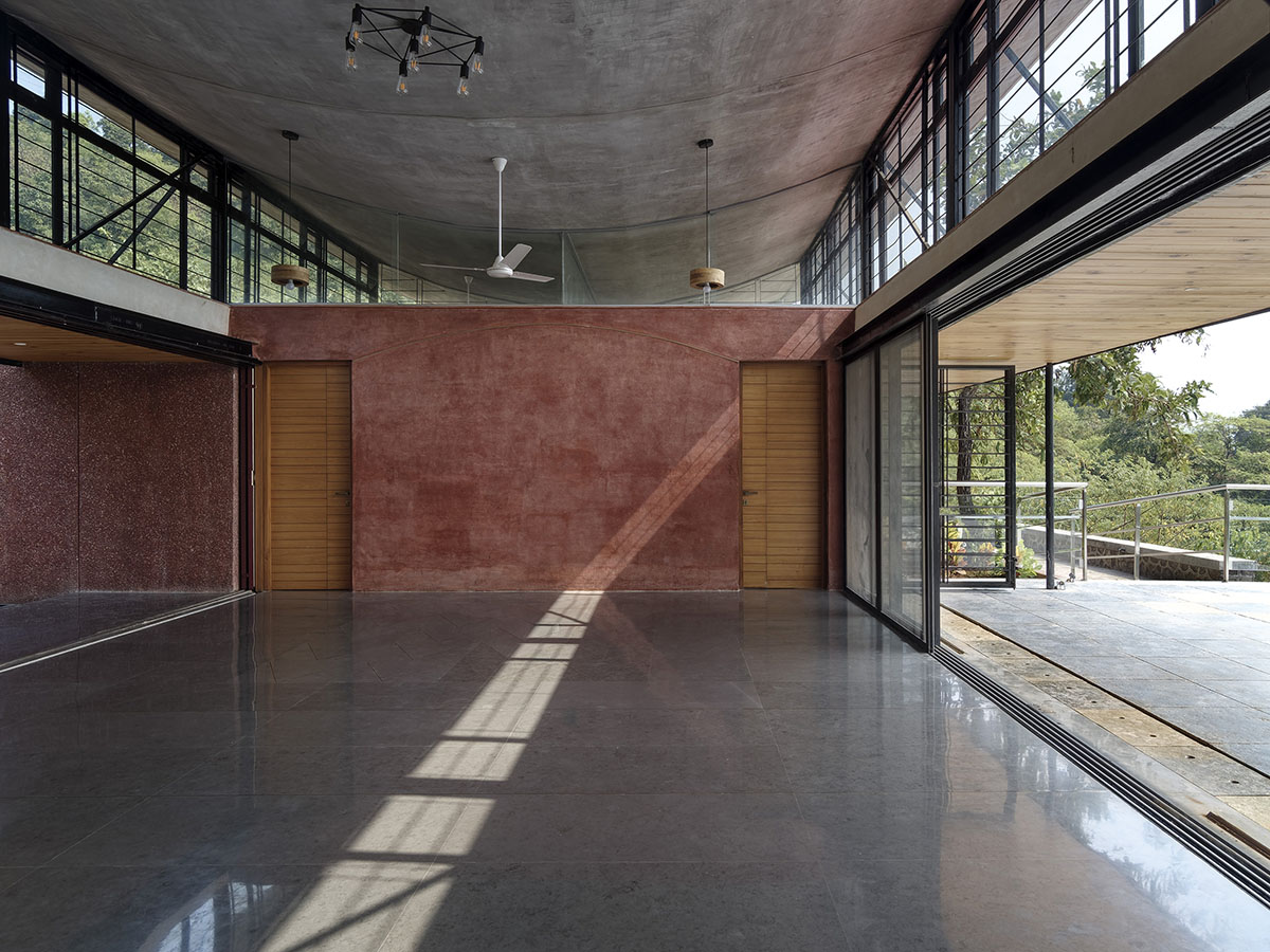 The Cove House by Red Brick Studio benefits from hilly slope and captures picturesque views in India