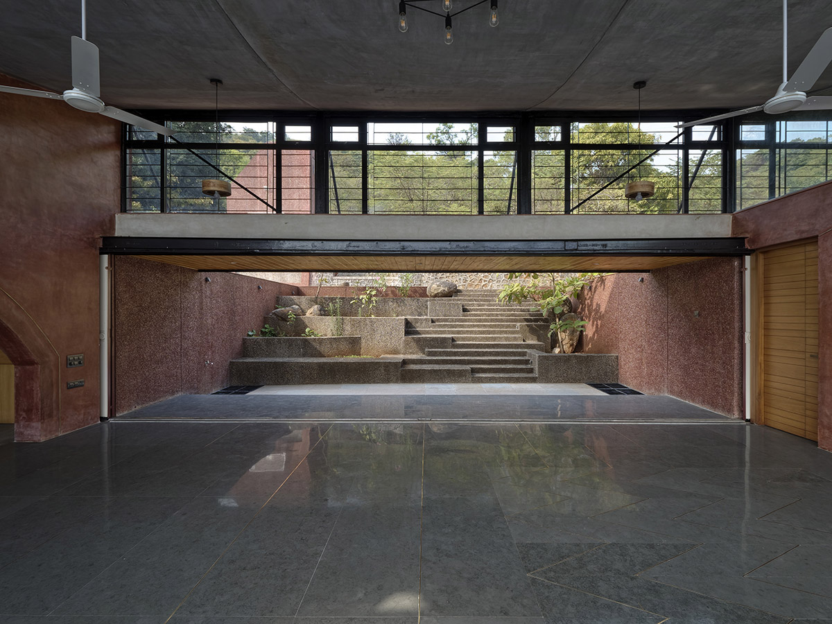 The Cove House by Red Brick Studio benefits from hilly slope and captures picturesque views in India