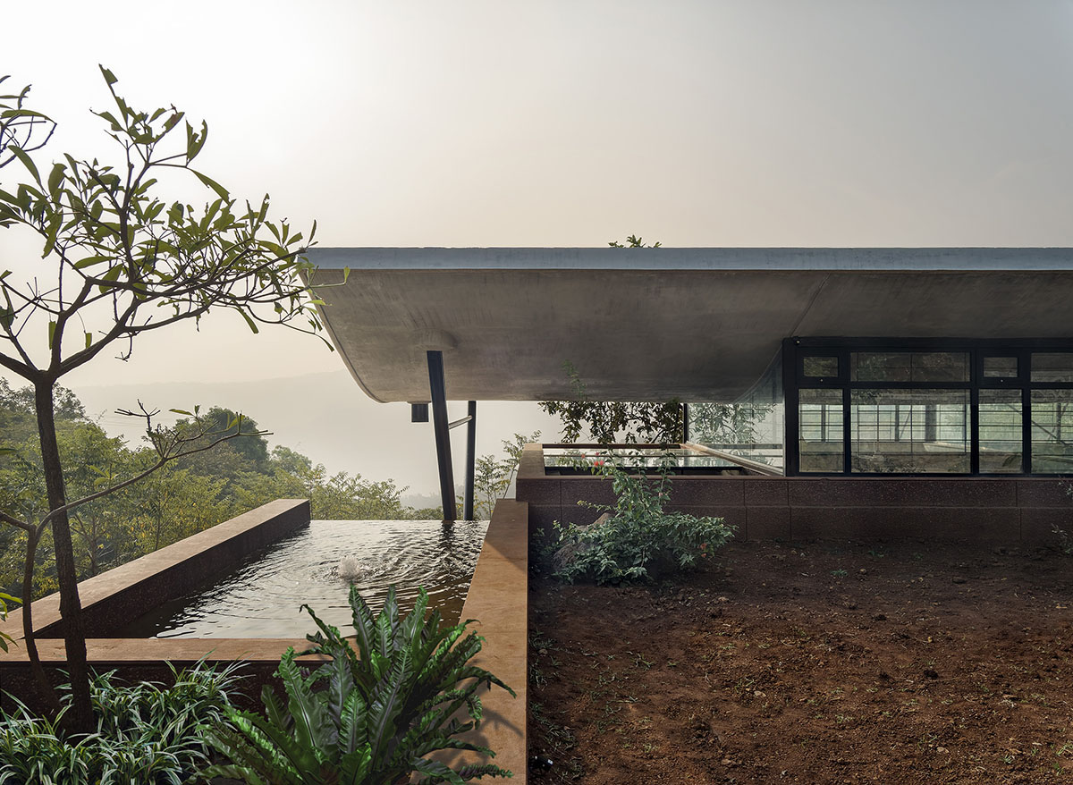 The Cove House by Red Brick Studio benefits from hilly slope and captures picturesque views in India