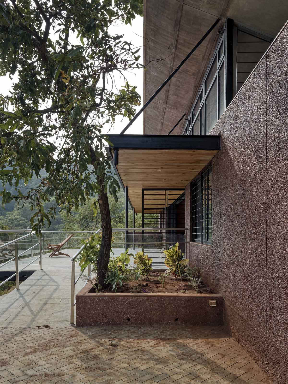 The Cove House by Red Brick Studio benefits from hilly slope and captures picturesque views in India