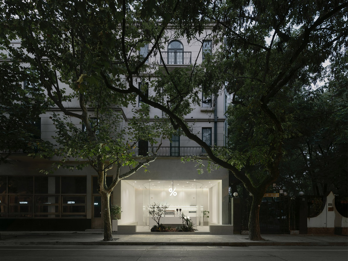 B.l.U.E. Architecture Studio designs this minimal coffee shop with glass frontage in Shanghai