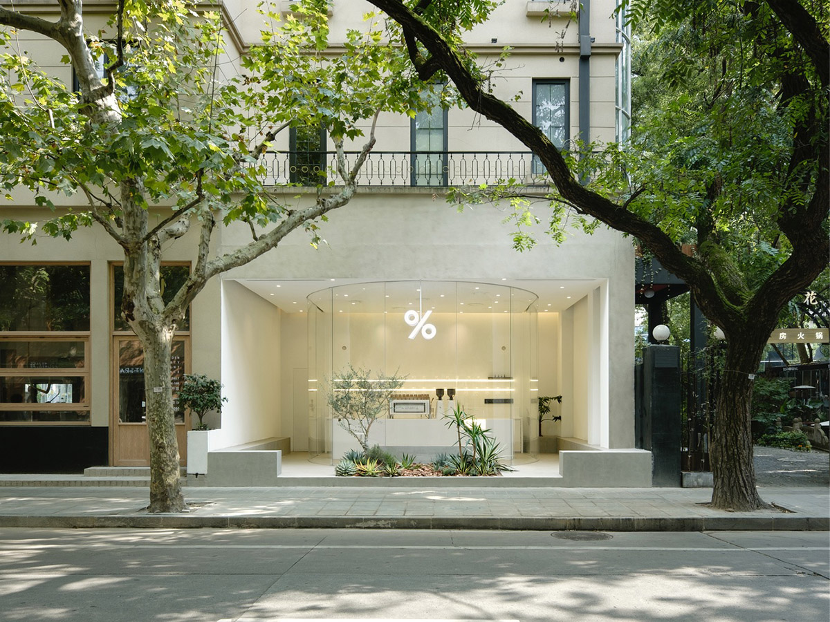 B.l.U.E. Architecture Studio designs this minimal coffee shop with glass frontage in Shanghai
