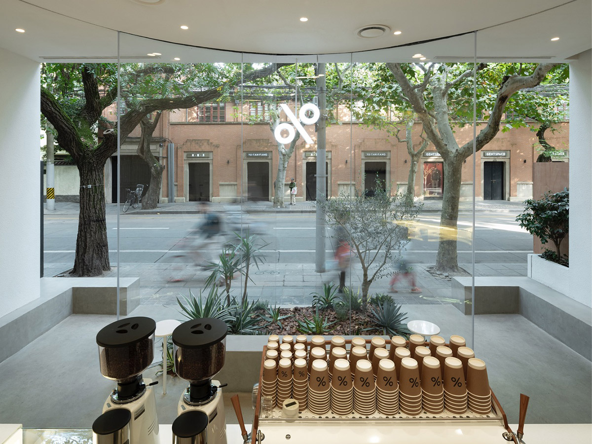 B.l.U.E. Architecture Studio designs this minimal coffee shop with glass frontage in Shanghai