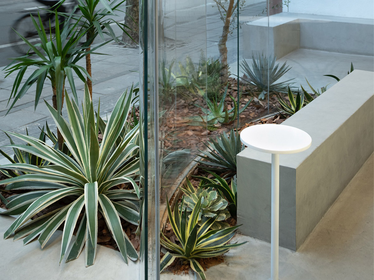 B.l.U.E. Architecture Studio designs this minimal coffee shop with glass frontage in Shanghai