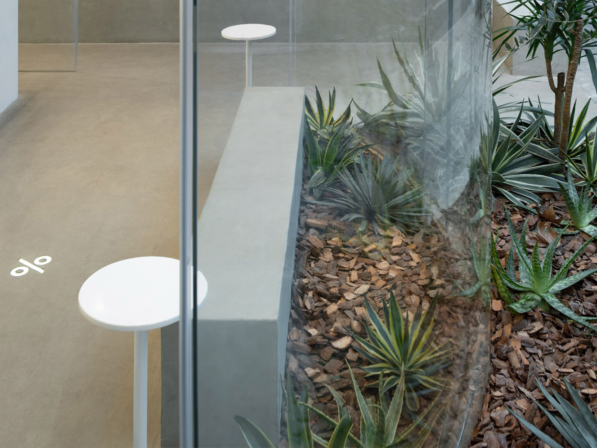 B.l.U.E. Architecture Studio designs this minimal coffee shop with glass frontage in Shanghai