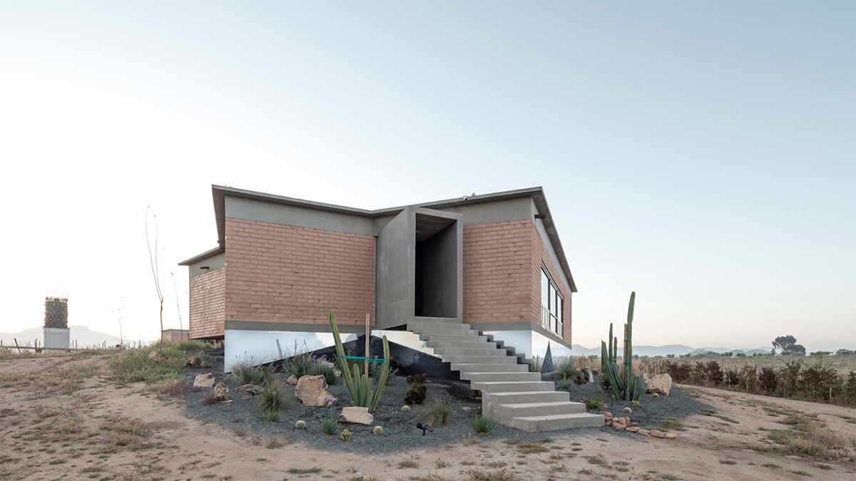 Santos Bolívar's rammed-earth hotel blocks are raised on inclined mirror bases in Mexican landscape