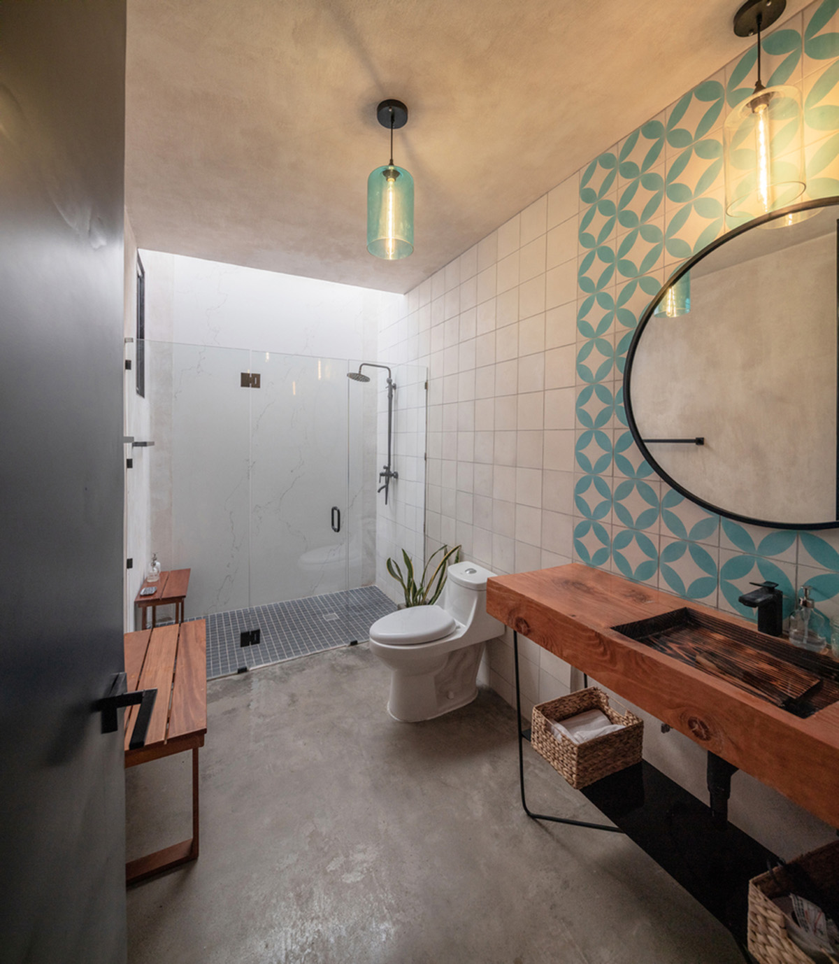 Santos Bolívar's rammed-earth hotel blocks are raised on inclined mirror bases in Mexican landscape