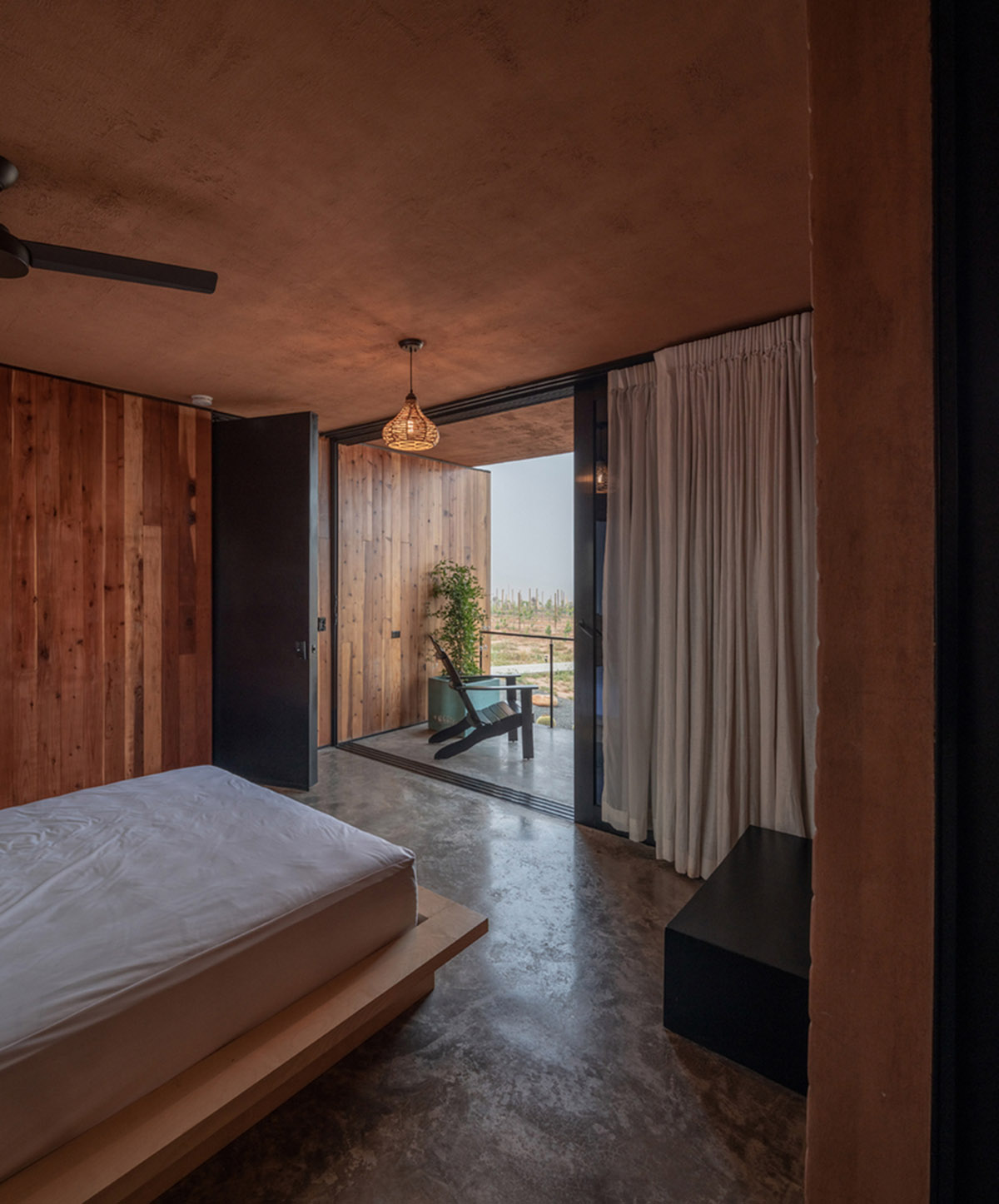 Santos Bolívar's rammed-earth hotel blocks are raised on inclined mirror bases in Mexican landscape