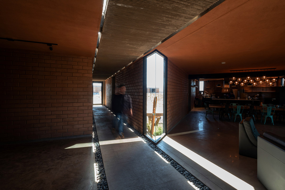 Santos Bolívar's rammed-earth hotel blocks are raised on inclined mirror bases in Mexican landscape