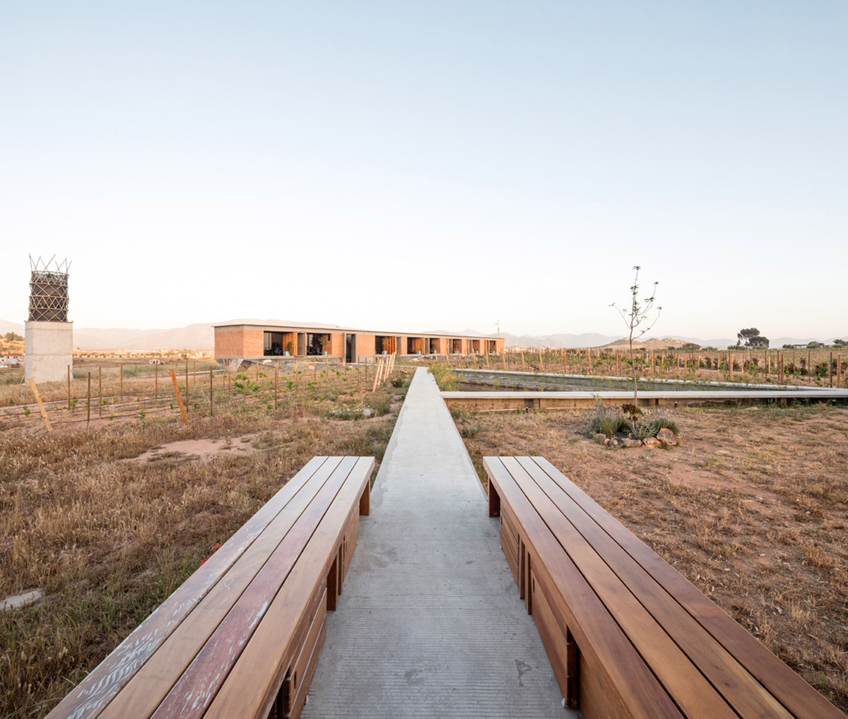 Santos Bolívar's rammed-earth hotel blocks are raised on inclined mirror bases in Mexican landscape