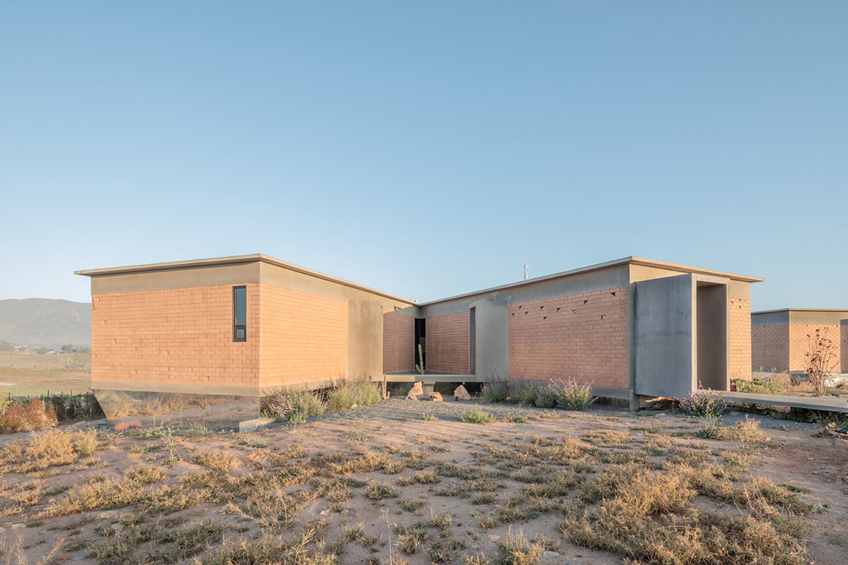 Santos Bolívar's rammed-earth hotel blocks are raised on inclined mirror bases in Mexican landscape