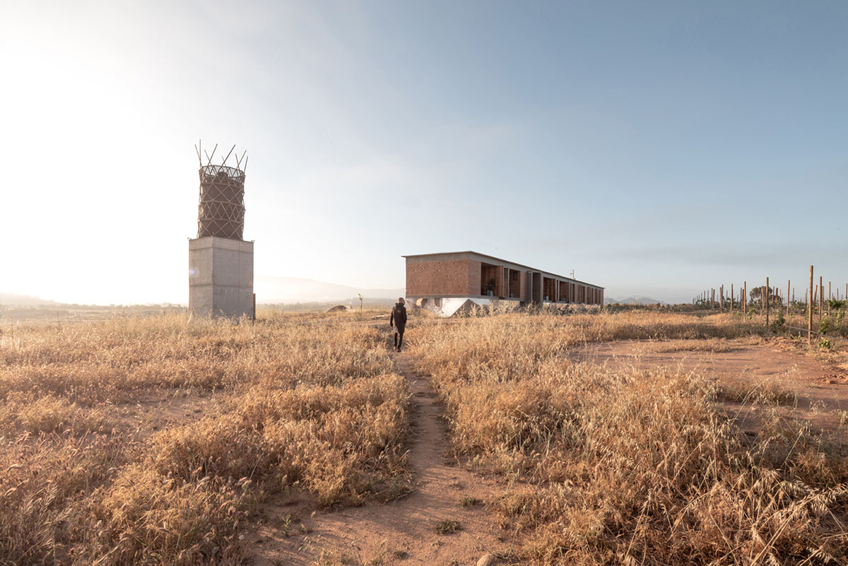 Santos Bolívar's rammed-earth hotel blocks are raised on inclined mirror bases in Mexican landscape