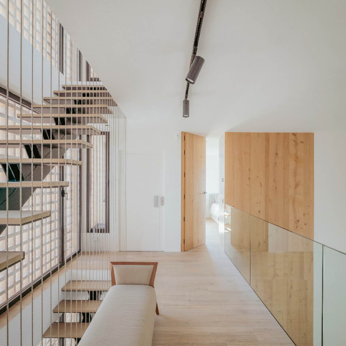 Casa Umbral features a brick-lattice façade that scatters soft light into the interior in Madrid