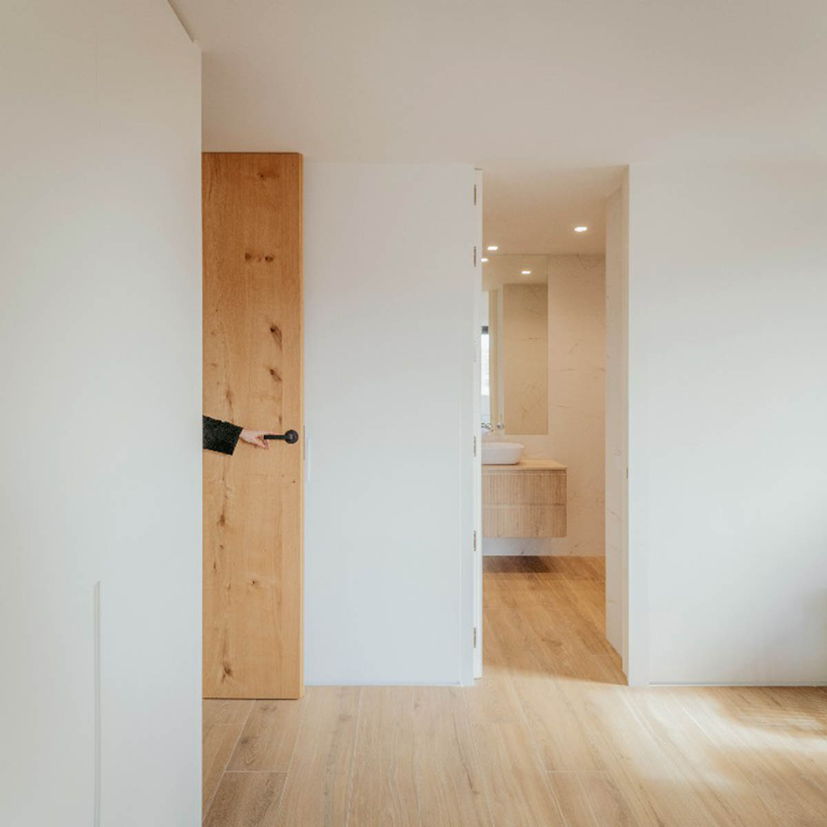 Casa Umbral features a brick-lattice façade that scatters soft light into the interior in Madrid
