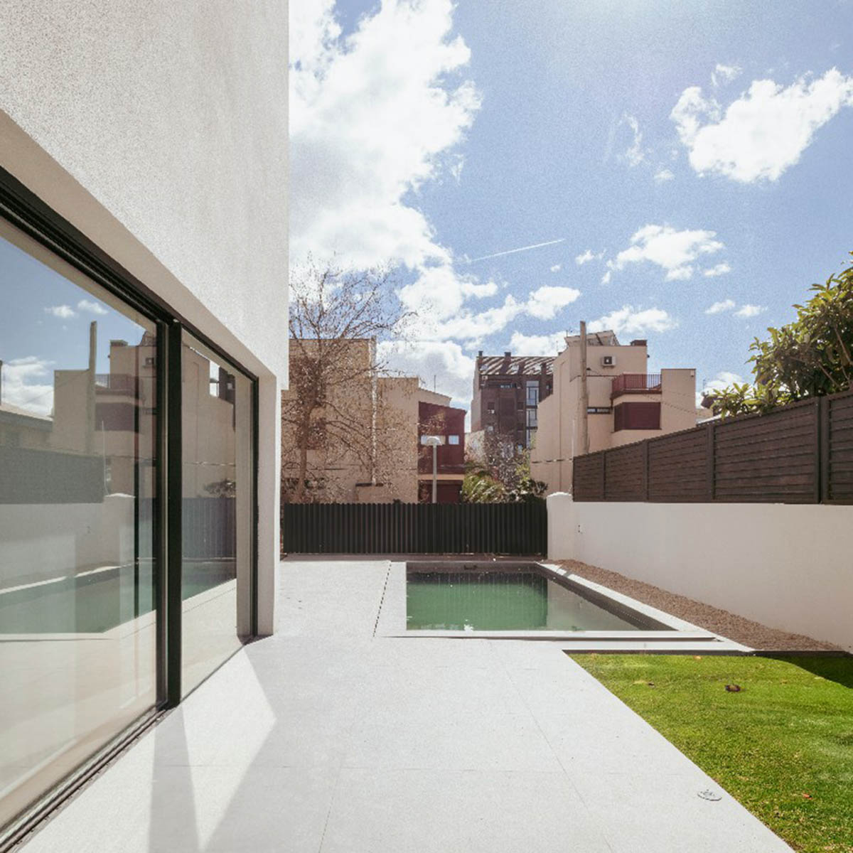 Casa Umbral features a brick-lattice façade that scatters soft light into the interior in Madrid