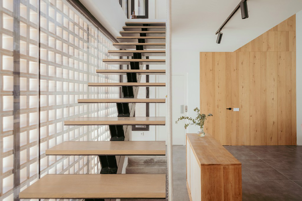 Casa Umbral features a brick-lattice façade that scatters soft light into the interior in Madrid