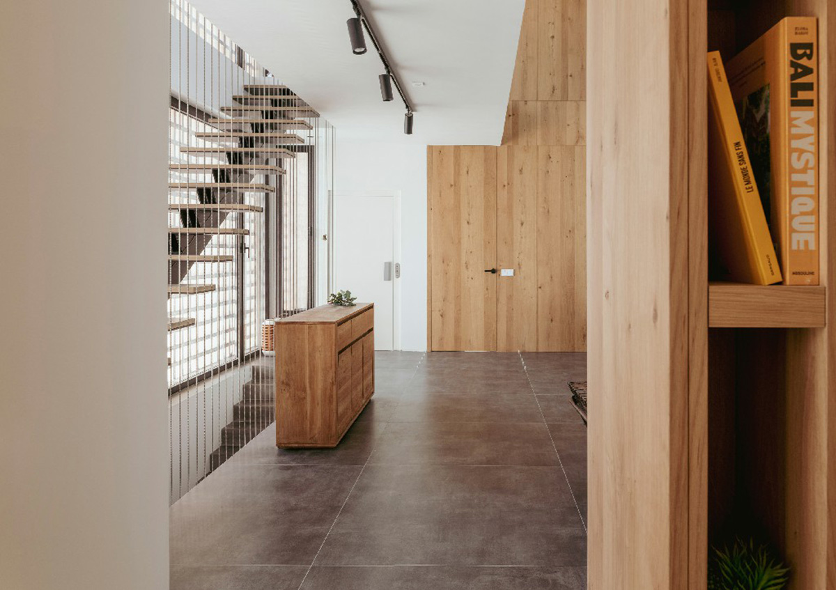 Casa Umbral features a brick-lattice façade that scatters soft light into the interior in Madrid