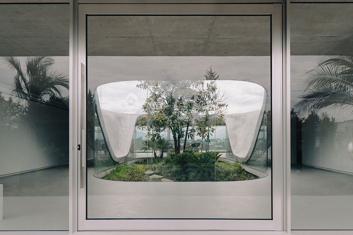 Estudio Felipe Escudero designs Magnolia House around a courtyard and magnolia tree in Ecuador