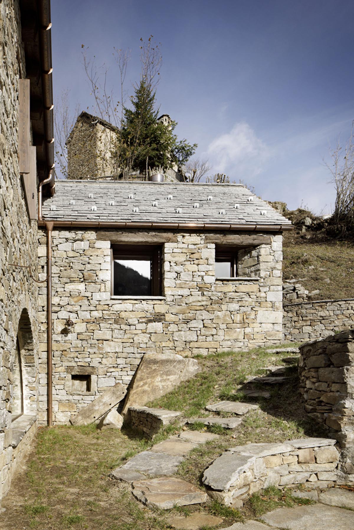 ATOMAA renovates old stone house with minimal additions and light-filled interiors in Varzo, Italy