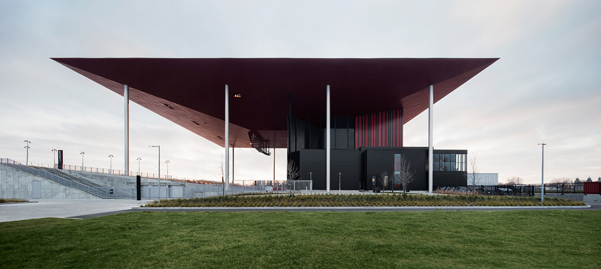 Paul Laurendeau completes outdoor summer amphitheater in Quebec with bold red floating roof