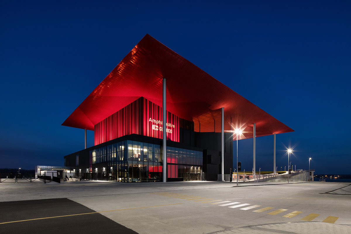 Paul Laurendeau completes outdoor summer amphitheater in Quebec with bold red floating roof