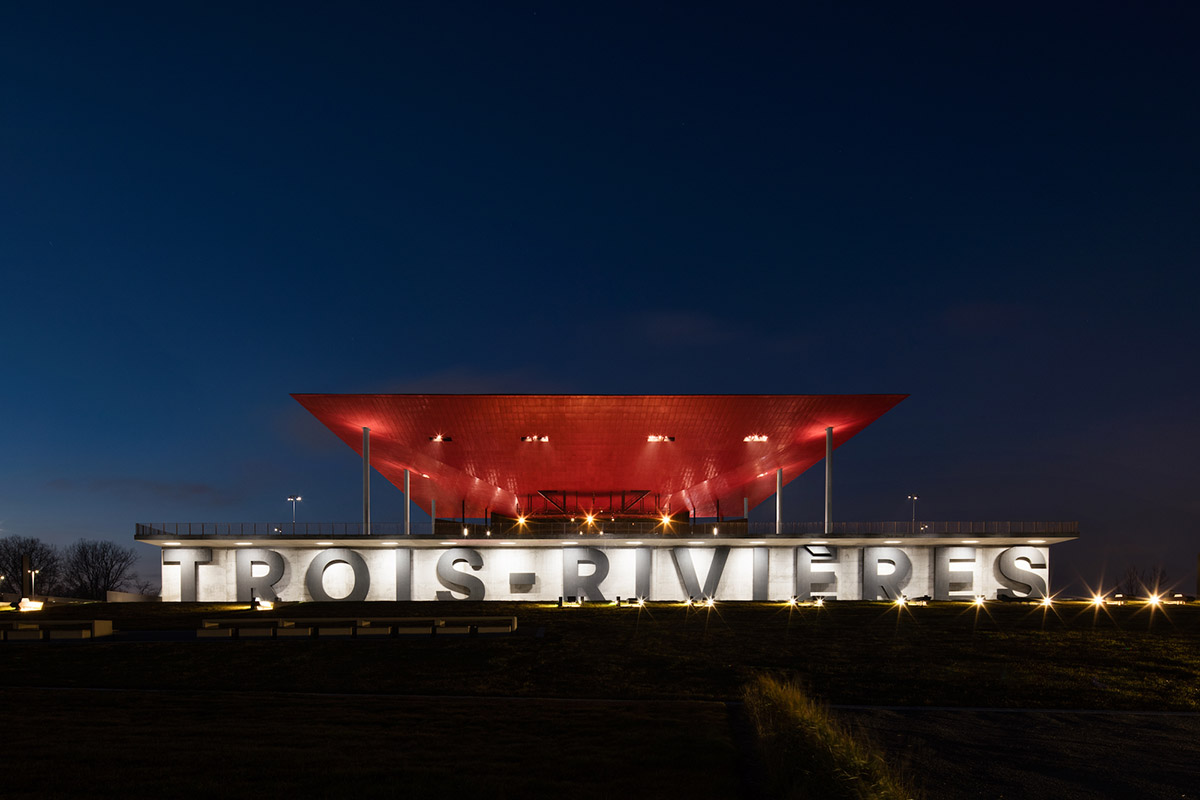 Paul Laurendeau completes outdoor summer amphitheater in Quebec with bold red floating roof