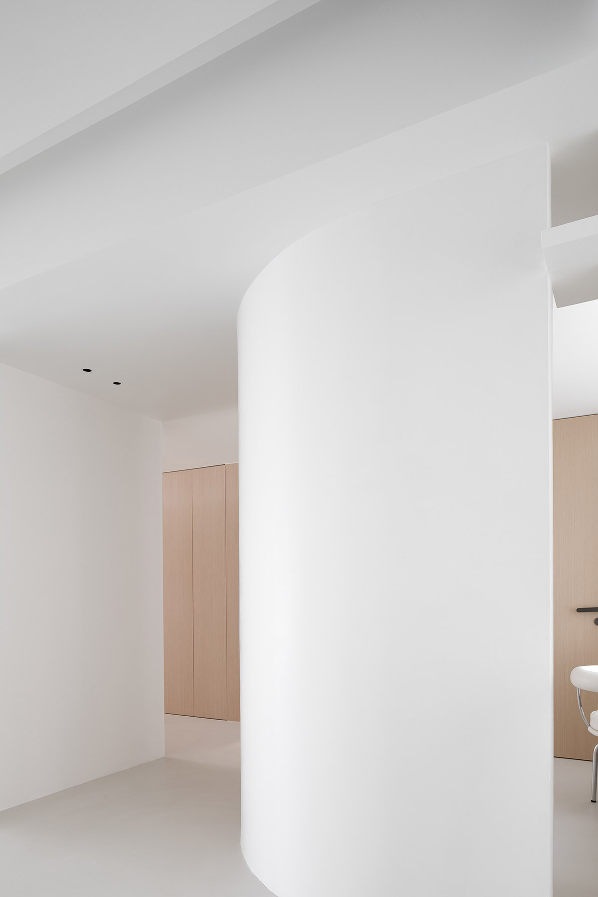 AD ARCHITECTURE creates all-white interiors with geometric compositions for L Apartment in China