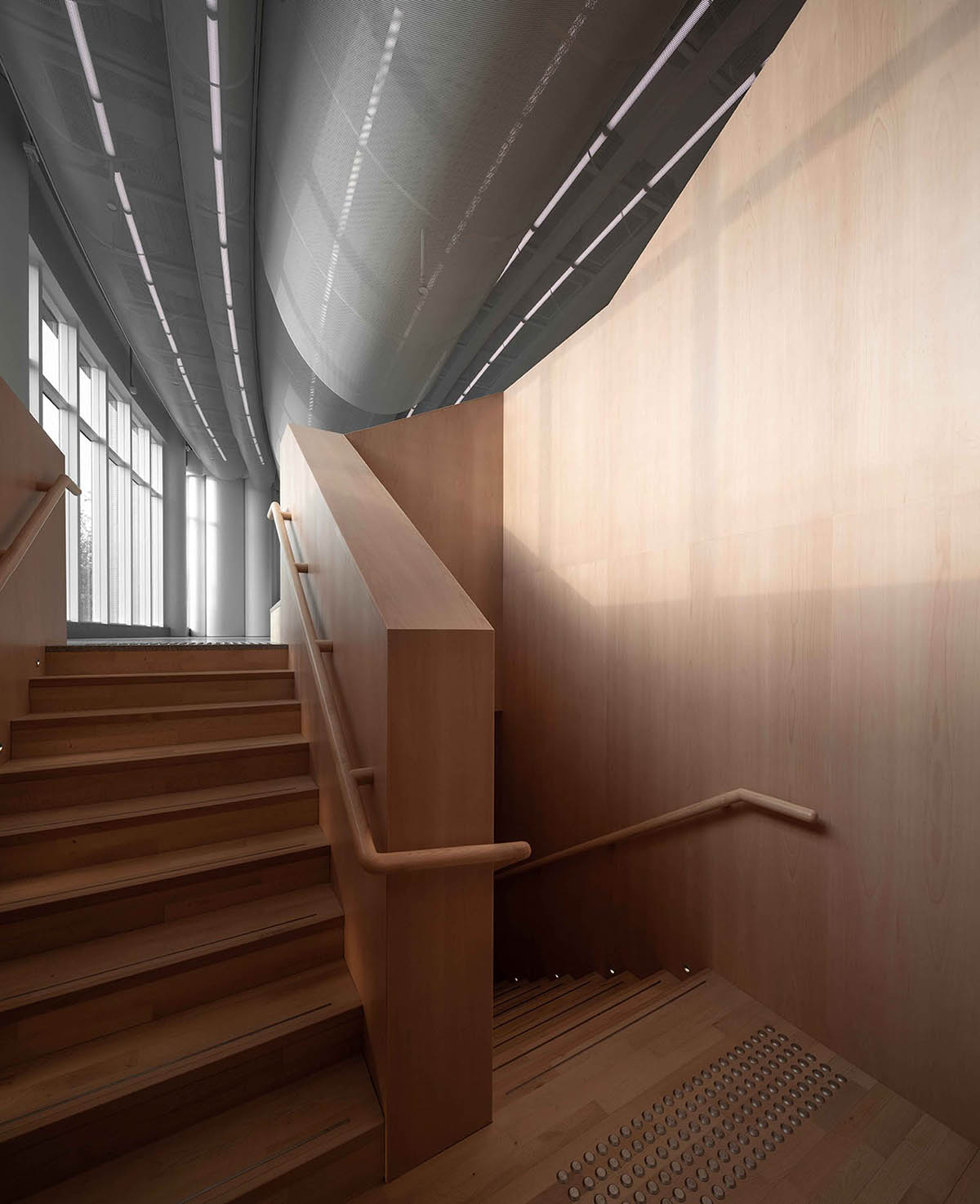 Atelier Nuno Architects suspends tubular aluminum panels from the ceiling of a lobby in Hong Kong