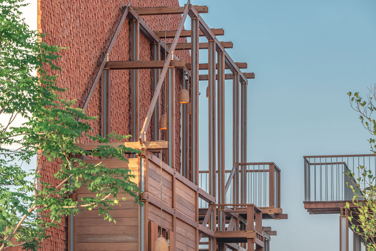 onion designs hotel and restaurant with handmade orange bricks in Thailand
