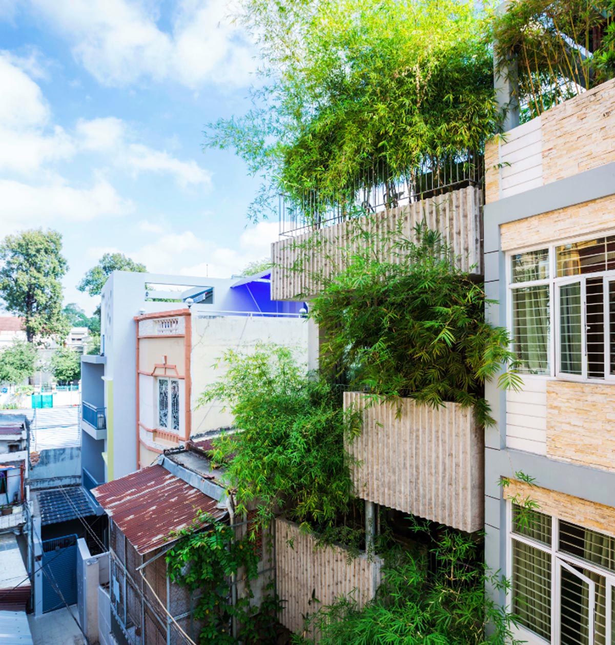 VTN Architects designs pop-up green facade for Bamboo House in a narrow site of Vietnam
