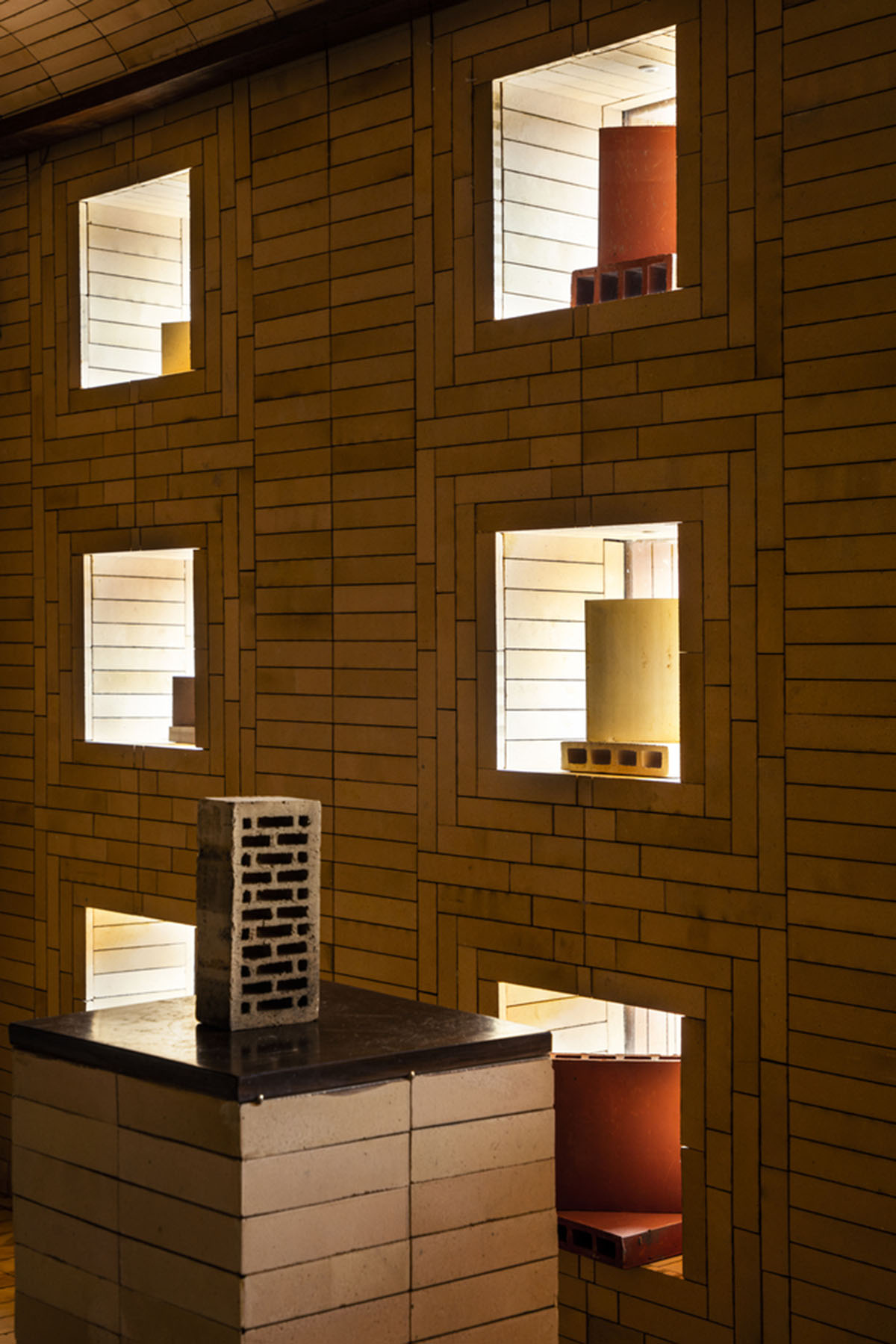 Brick showroom is made of various hues of modular brick celebrating resilient feature of material