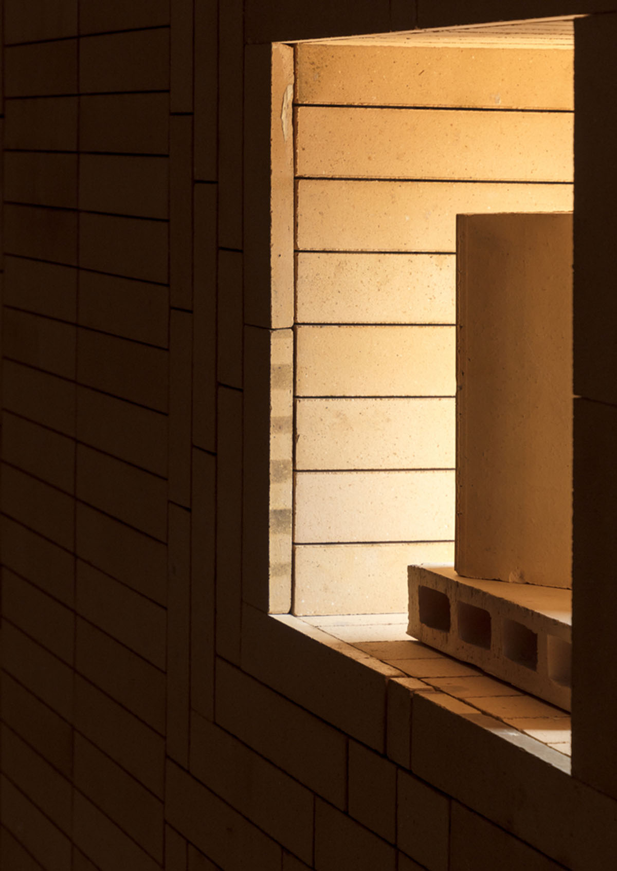 Brick showroom is made of various hues of modular brick celebrating resilient feature of material