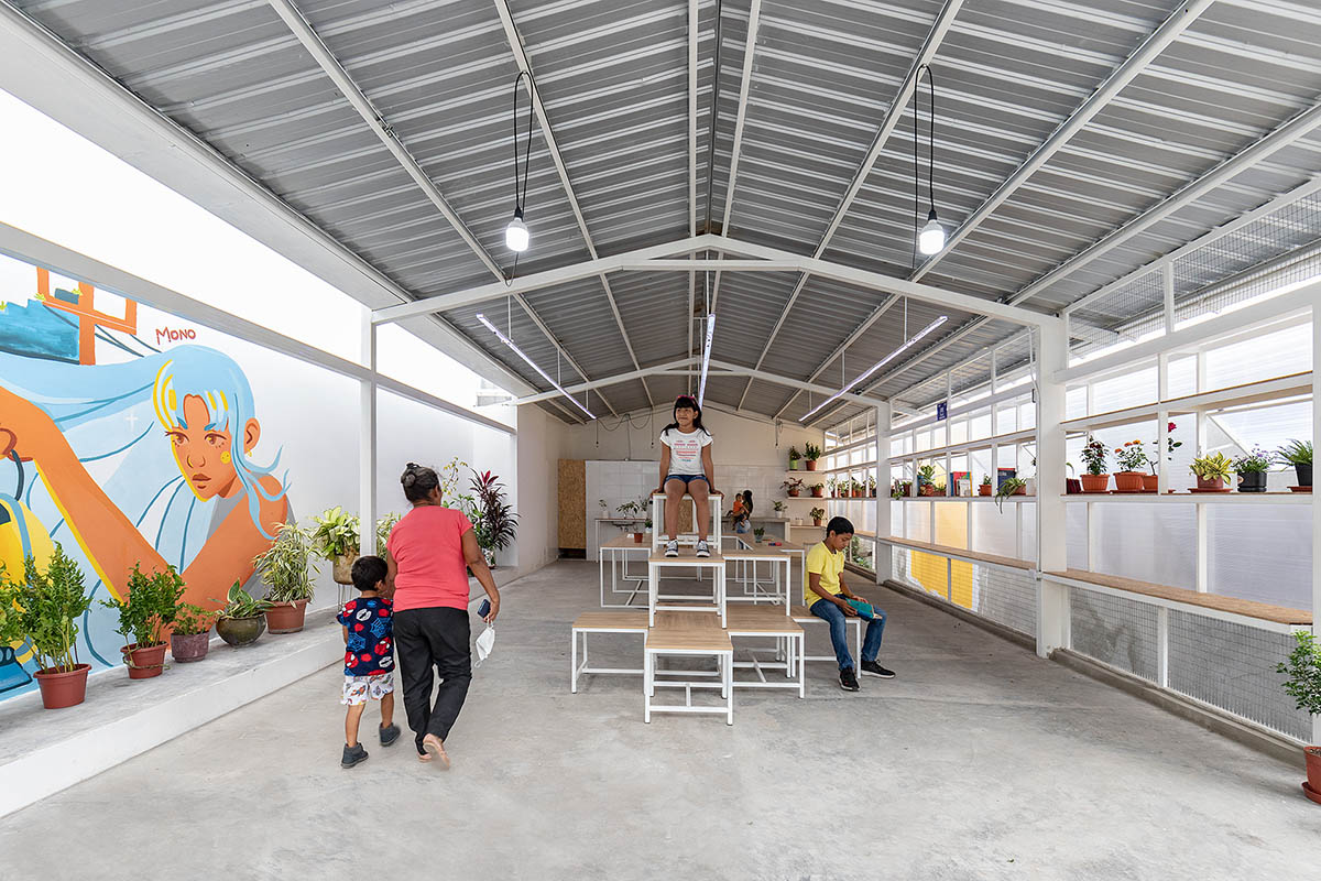 Permeable community house is inserted into Ecuador's existing fabric to serve micro communities 