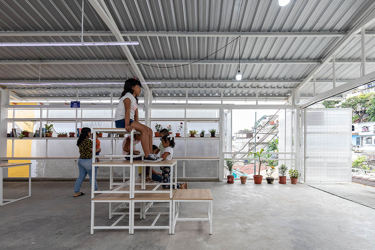 Permeable community house is inserted into Ecuador's existing fabric to serve micro communities 
