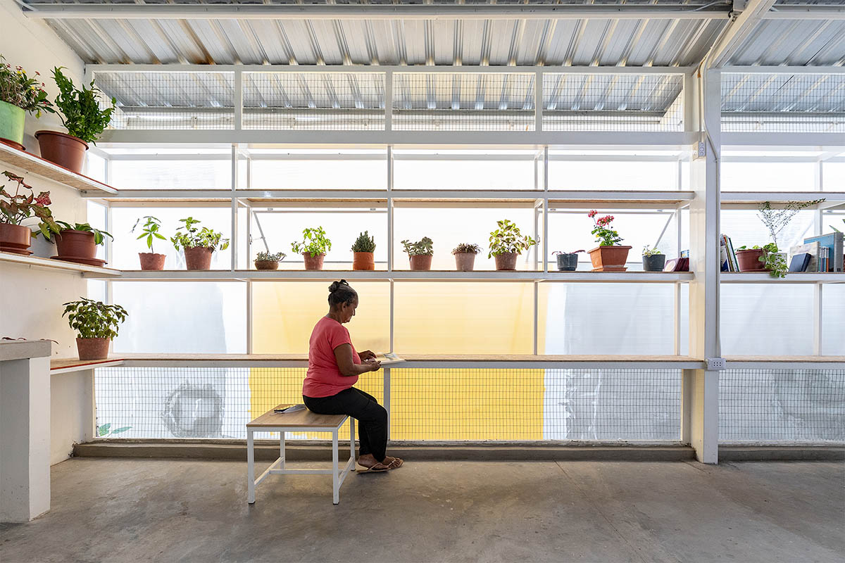 Permeable community house is inserted into Ecuador's existing fabric to serve micro communities 