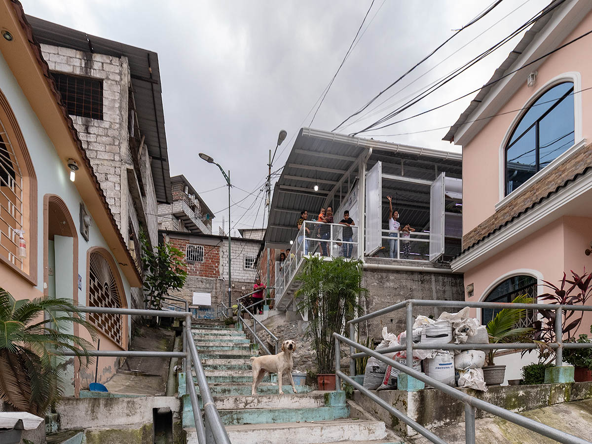 Permeable community house is inserted into Ecuador's existing fabric to serve micro communities 