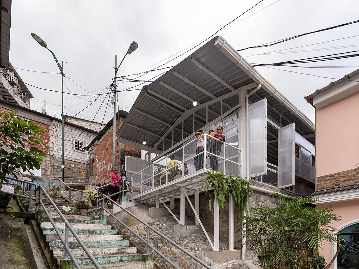 Permeable community house is inserted into Ecuador's existing fabric to serve micro communities 
